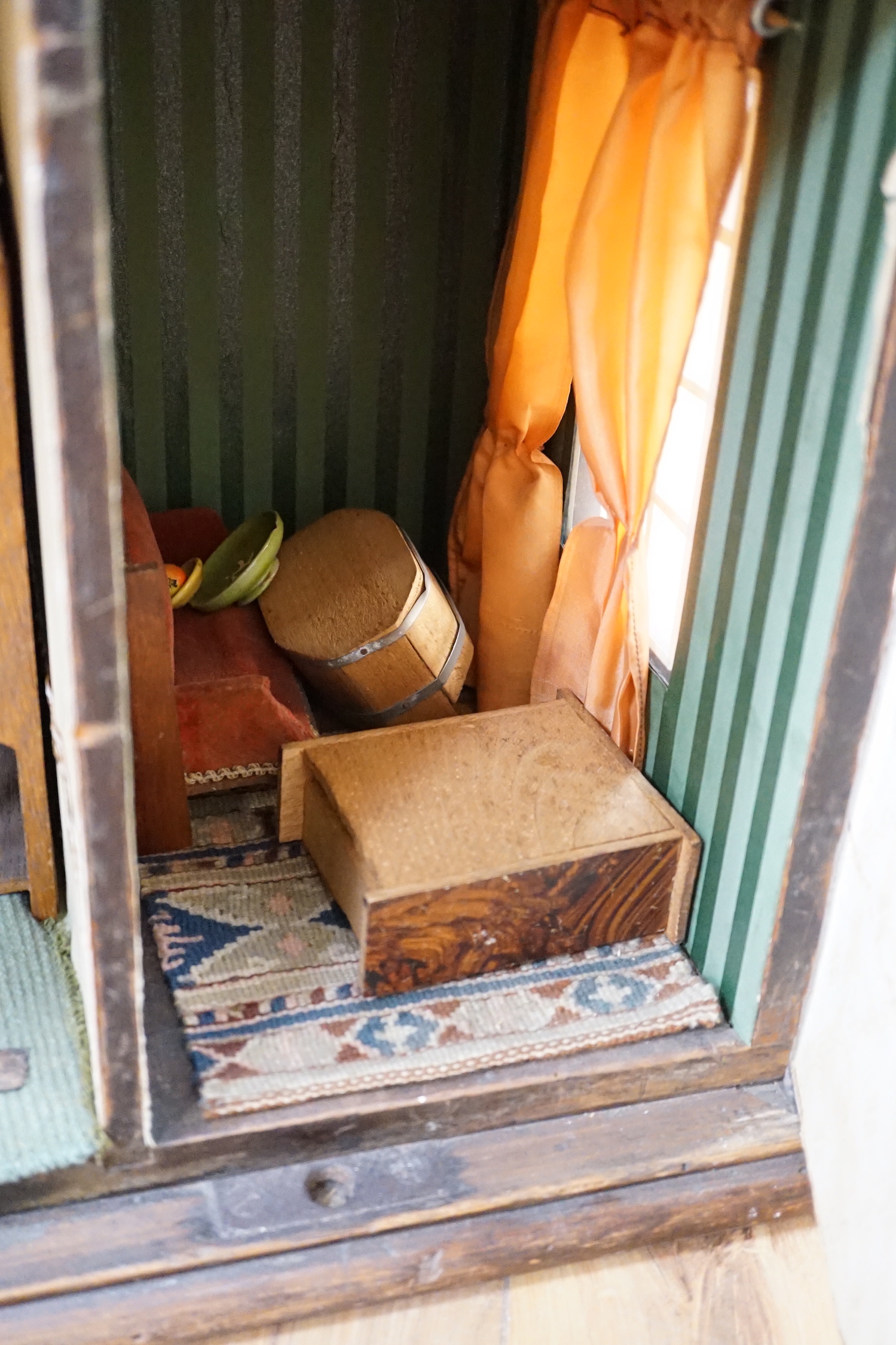 A furnished English dolls’ house, circa 1810-20, 104cm high